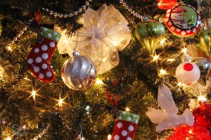 Silver balls with red and white polka dots. White sheer bows throughout the tree.