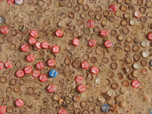 Coke caps in the dirt